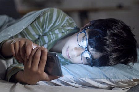 A Child Using an AI Chatbot at Night